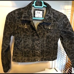 Black printed jeans jacket.